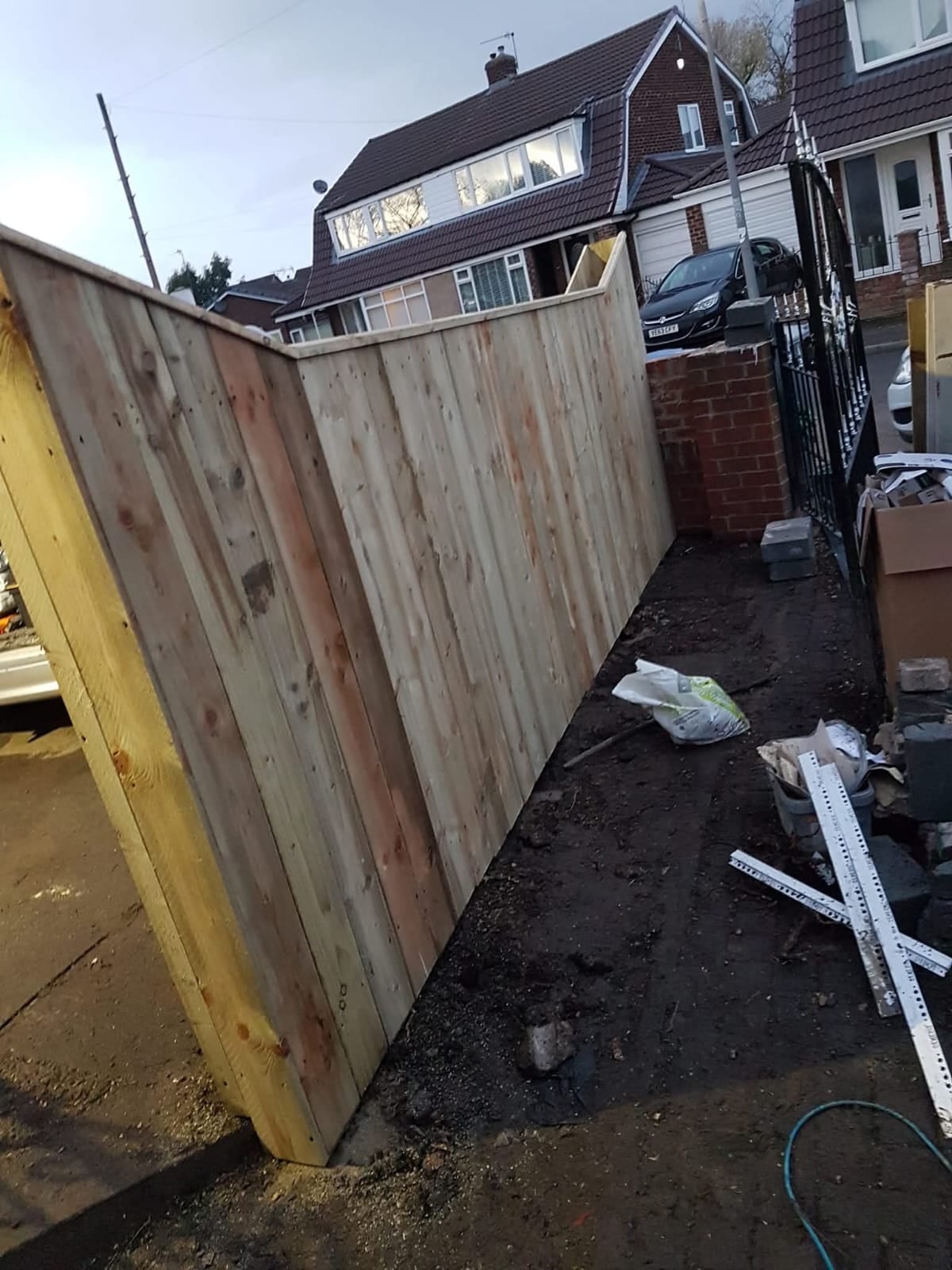 New garden fence panels fitted beside a path by Ashurst and Sons Roofing