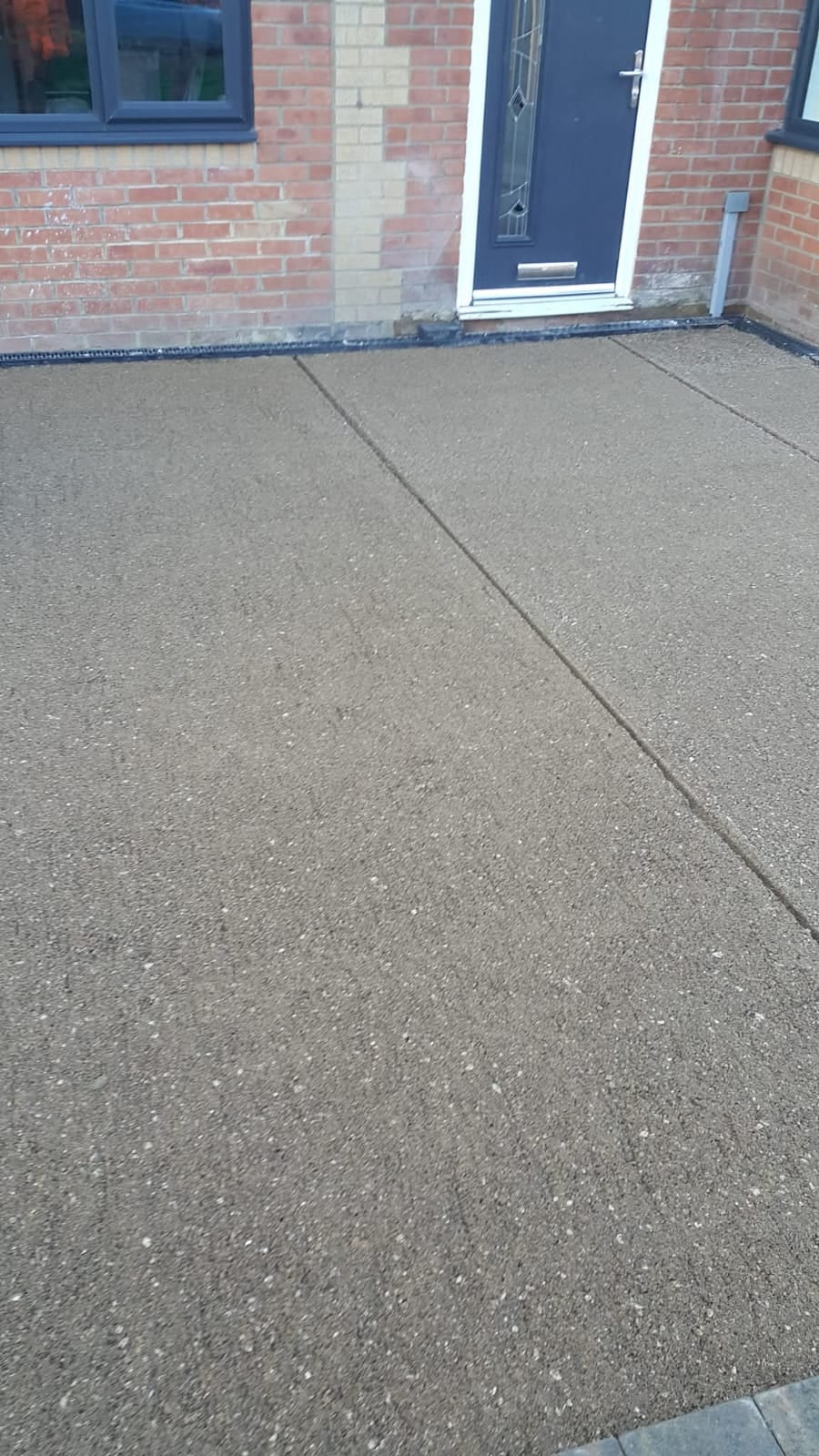 Resin style driveway surface at a front entrance
