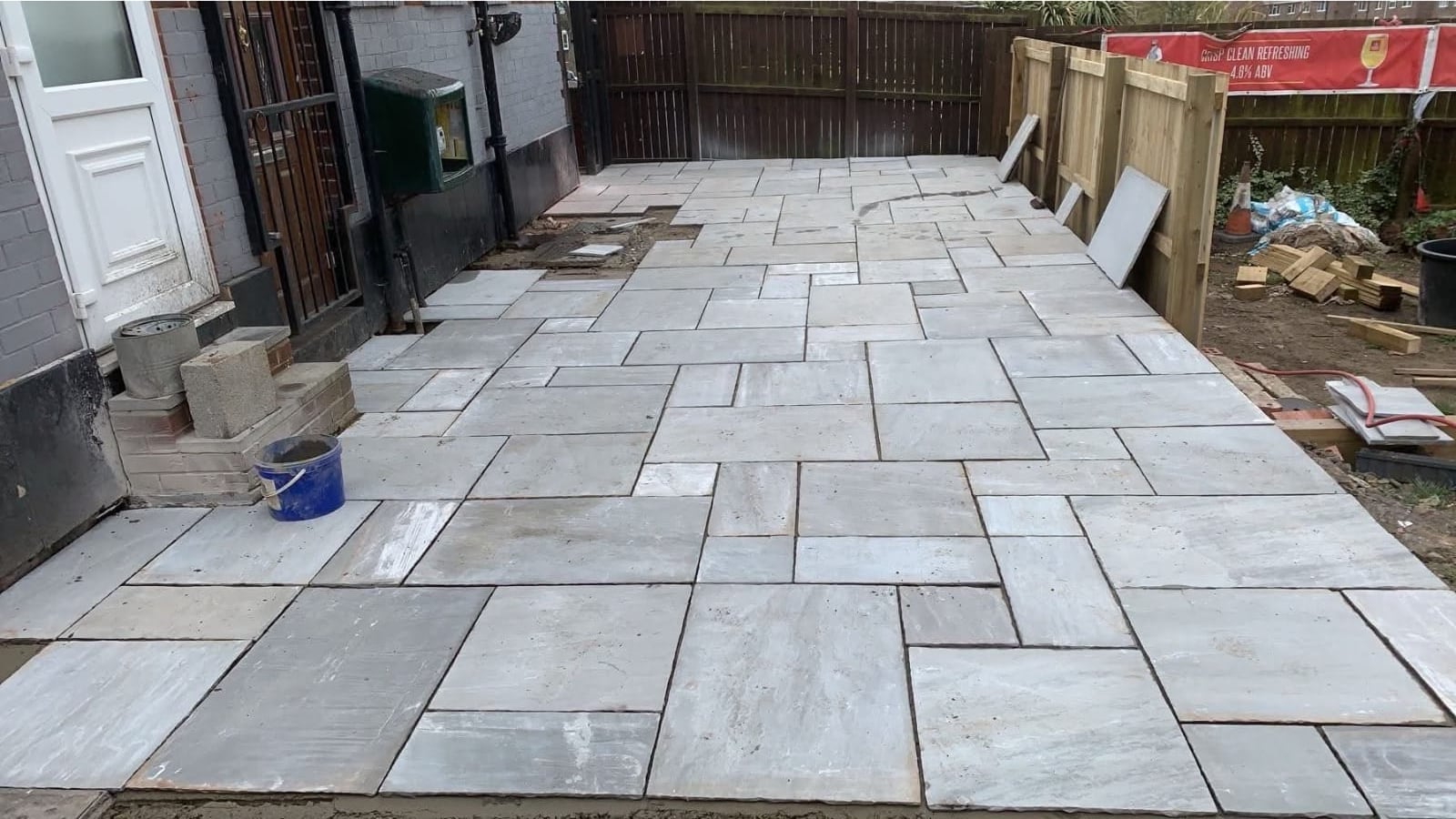 Light paving slabs fitted alongside a property